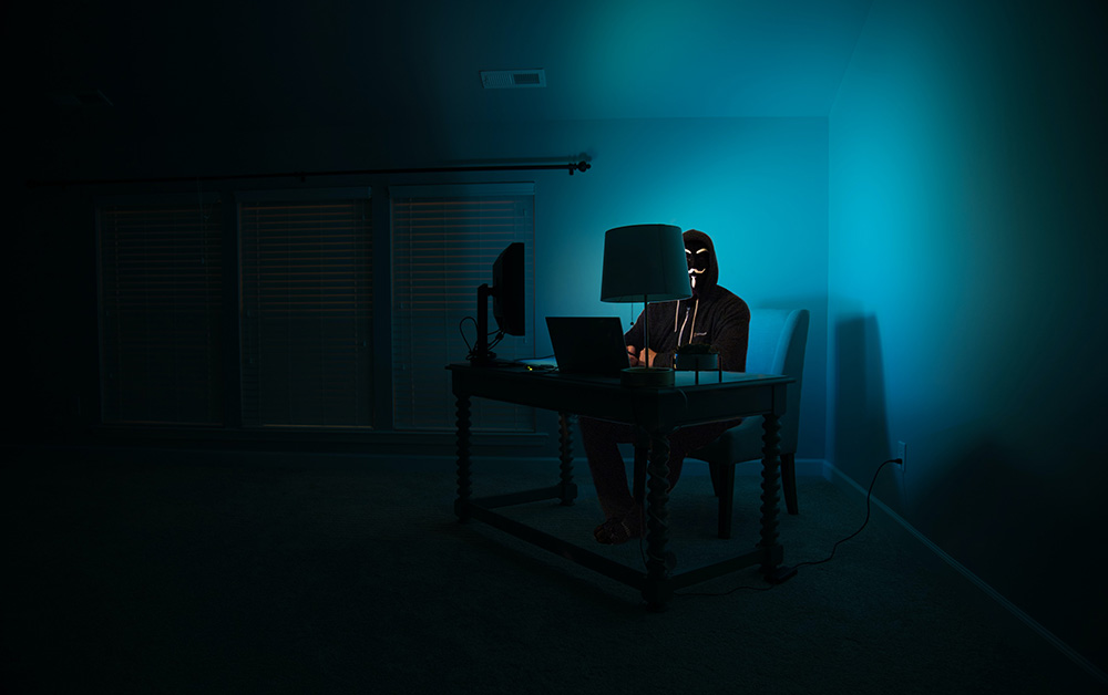 Hacker sitting at his desk